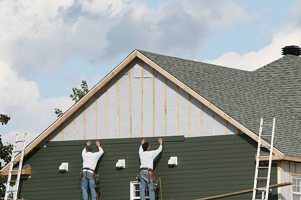 Professional Siding Contractor technician working in Huron, OH